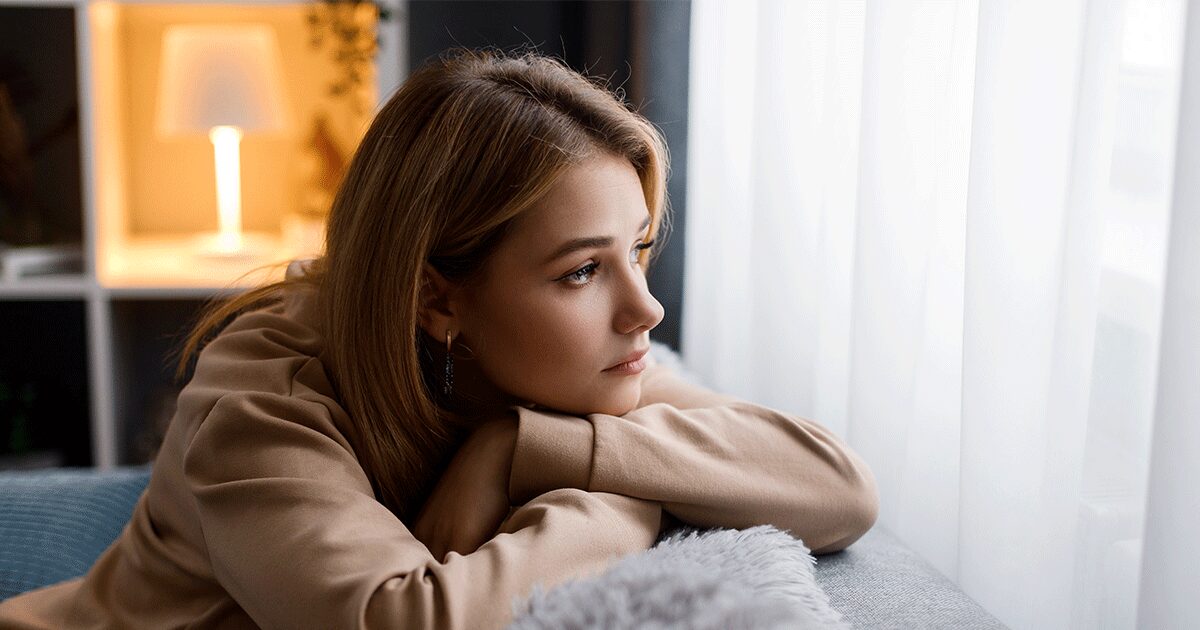 Young woman feeling uncertain about becoming a parent