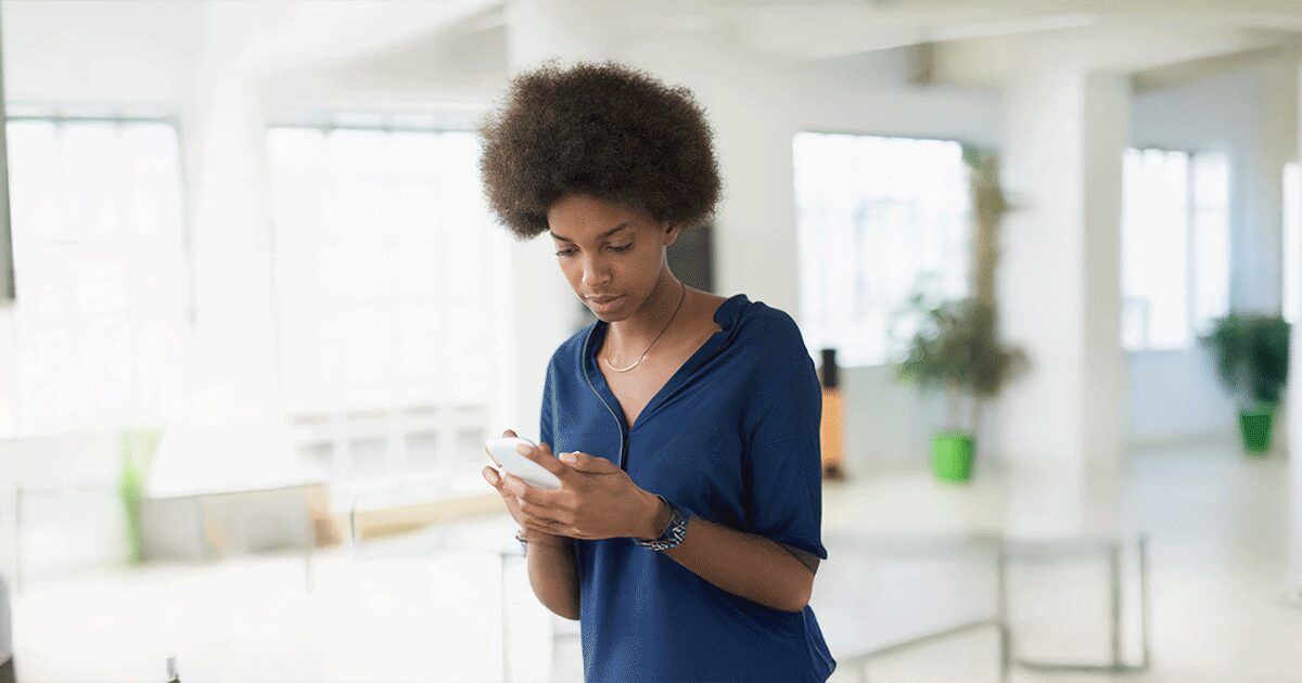 Woman considering abortion uses her phone to learn why an ultrasound is important.